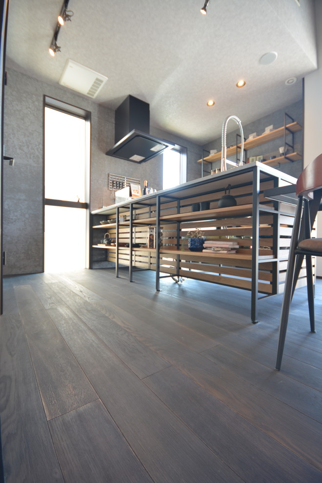 Industrial single-wall eat-in kitchen in Other with open cabinets, medium wood cabinets, timber splashback, dark hardwood floors, with island and black floor.