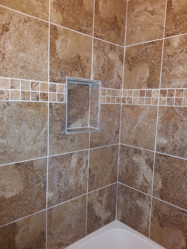 Mid-sized transitional 3/4 porcelain tile and brown floor alcove bathtub photo with furniture-like cabinets, dark wood cabinets, a two-piece toilet, white walls, an integrated sink, quartz countertops and white countertops