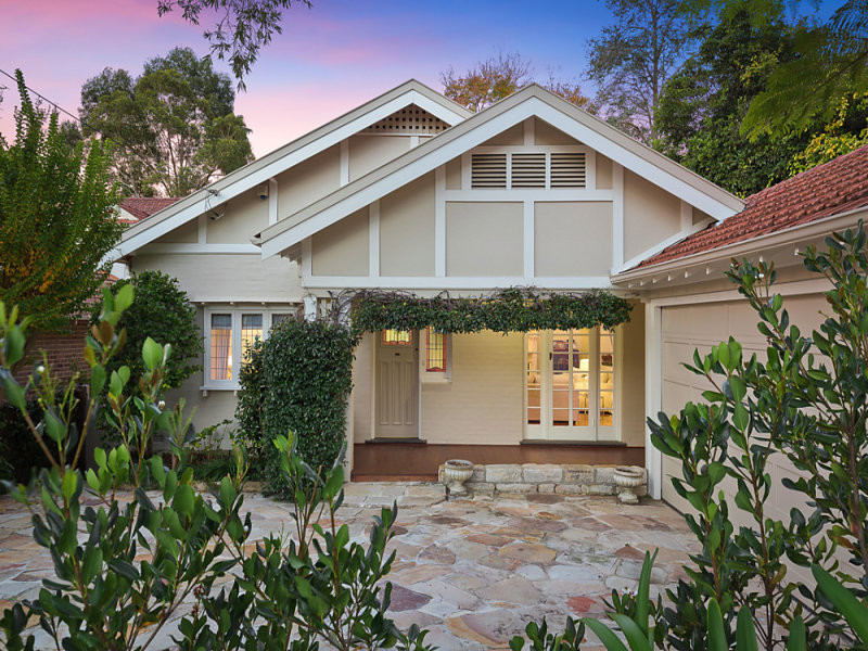 Photo of a mid-sized arts and crafts one-storey brick white exterior in Sydney with a gable roof.