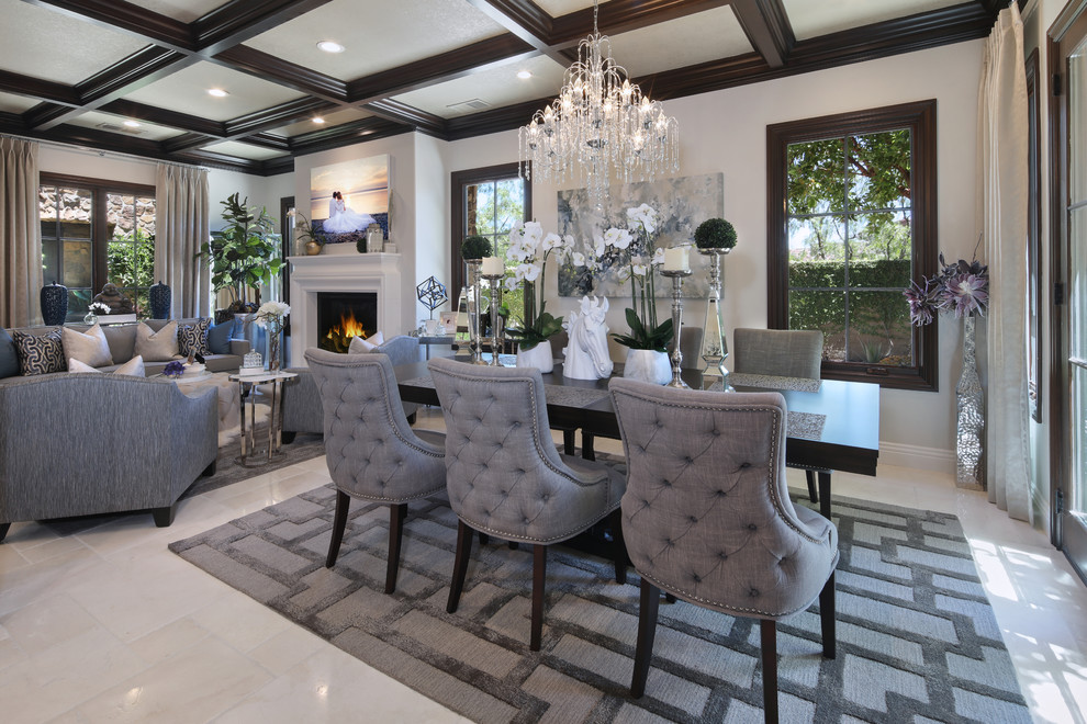 Inspiration for a mid-sized contemporary open plan dining in Orange County with white walls, ceramic floors, a standard fireplace, a wood fireplace surround and beige floor.