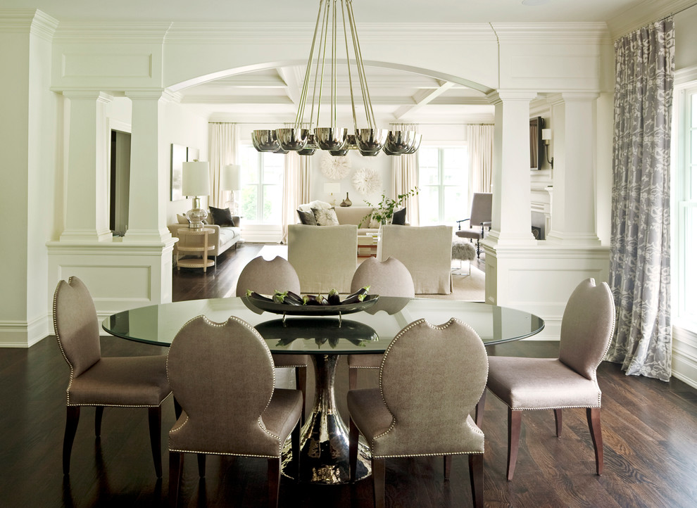 Design ideas for a transitional dining room in New York with white walls and dark hardwood floors.