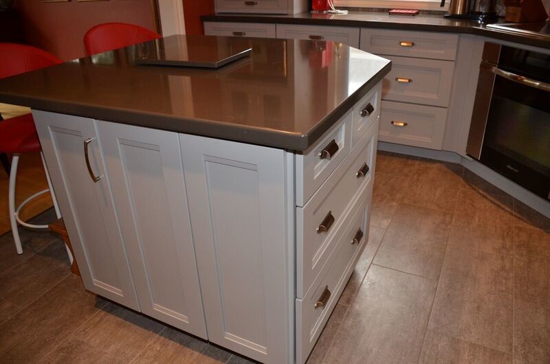Mid-sized eclectic l-shaped vinyl floor enclosed kitchen photo in Toronto with an undermount sink, recessed-panel cabinets, gray cabinets, quartzite countertops, gray backsplash, stainless steel appliances and an island