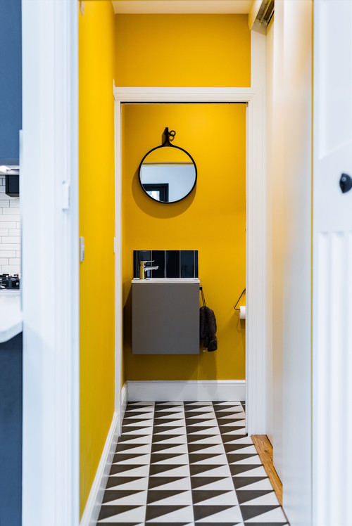 A Splash of Color: A Burst of Yellow with Gray and White Floor Tiles