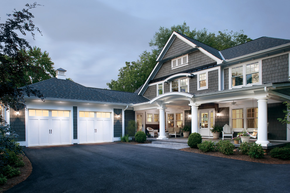 Inspiration for a large beach style attached two-car garage in Cincinnati.