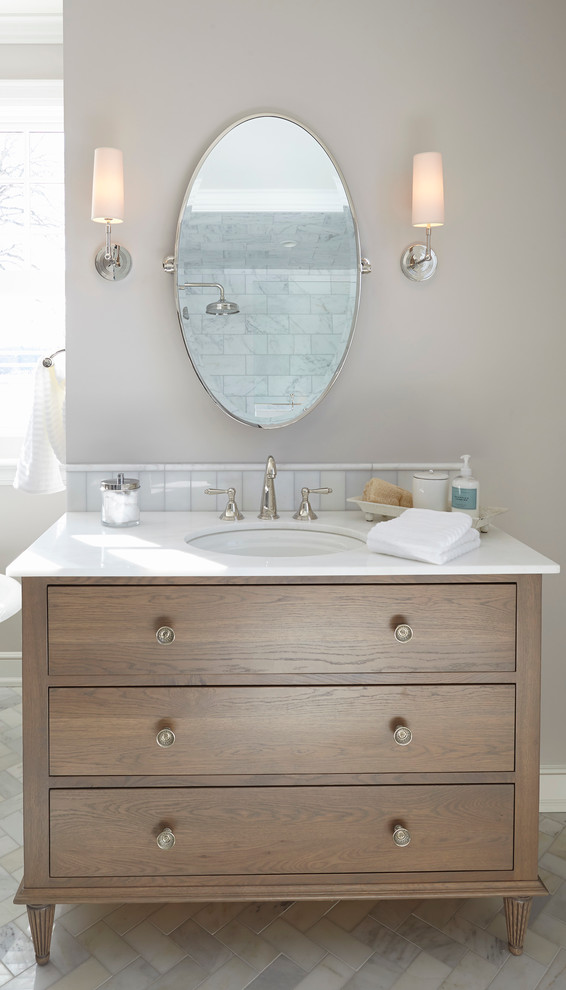 Design ideas for a beach style bathroom in Minneapolis with an undermount sink, flat-panel cabinets, medium wood cabinets, white tile and grey walls.