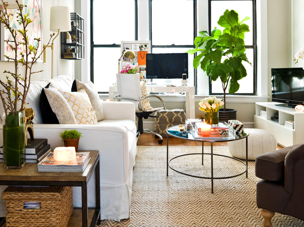Inspiration for a mid-sized eclectic enclosed living room in Chicago with a freestanding tv.