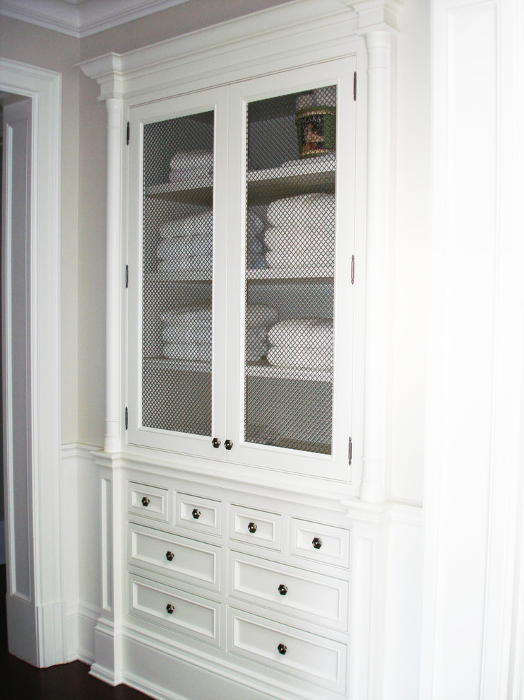 This is an example of a transitional storage and wardrobe in Toronto.