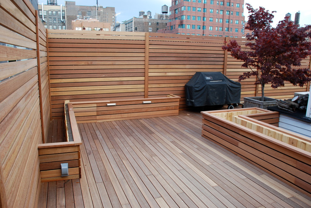 Design ideas for a large contemporary rooftop deck in New York with a container garden and a pergola.