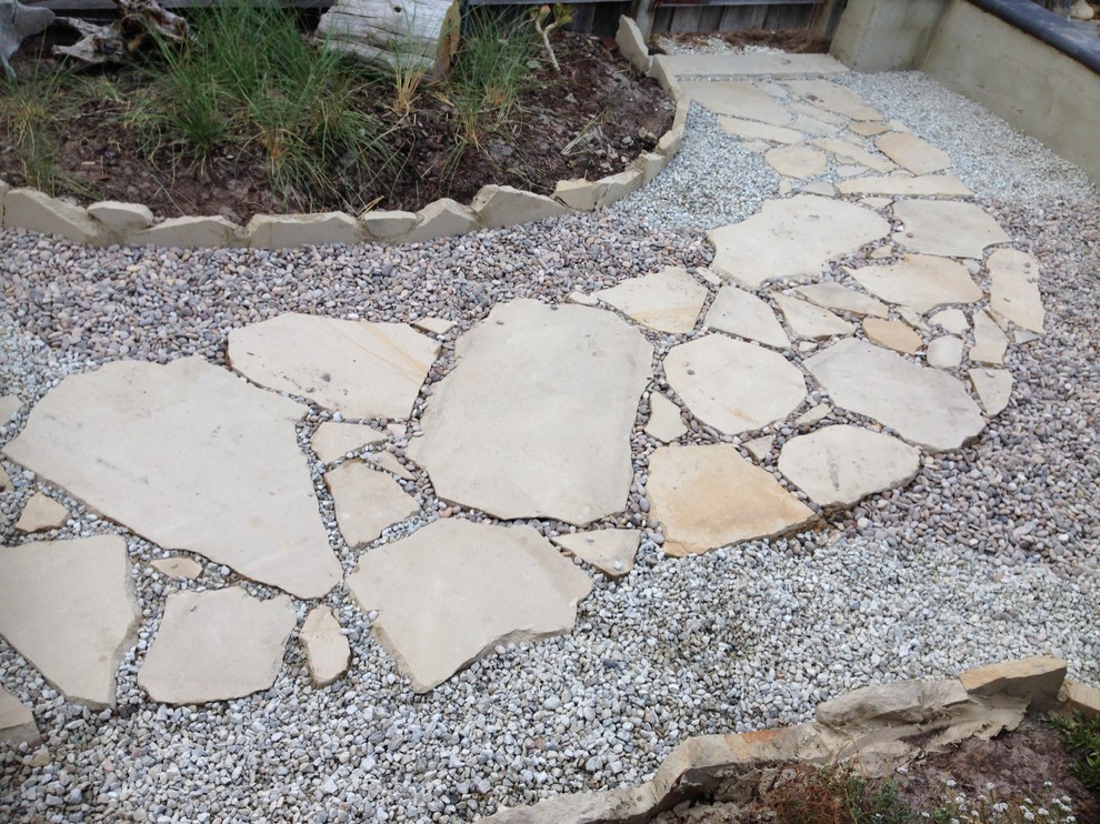 Inspiration for a beach style courtyard garden in Hobart with a garden path.