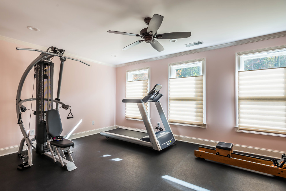 Design ideas for a small country multipurpose gym in Atlanta with pink walls and black floor.
