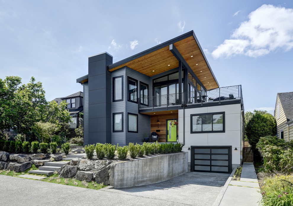 This is an example of a contemporary multi-coloured house exterior in Seattle with a shed roof.