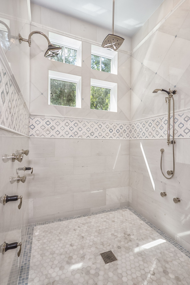 Traditional bathroom in Miami with a double shower, gray tile, stone tile and mosaic tile floors.