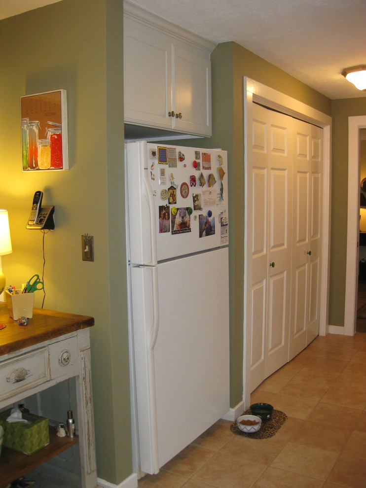 Inspiration for a transitional l-shaped ceramic tile and beige floor kitchen remodel in Boston with an undermount sink, shaker cabinets, white cabinets, granite countertops, white appliances and green countertops
