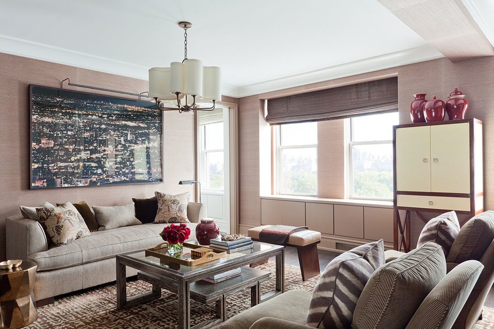 Photo of a transitional living room in New York with beige walls and dark hardwood floors.