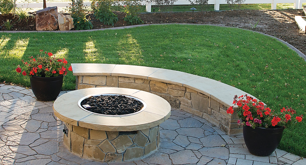 Inspiration for a mid-sized backyard concrete paver landscaping in Denver with a fire pit.