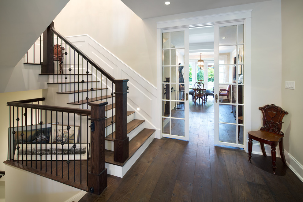 Inspiration for a mid-sized traditional foyer in Vancouver with beige walls, dark hardwood floors, a double front door and a white front door.