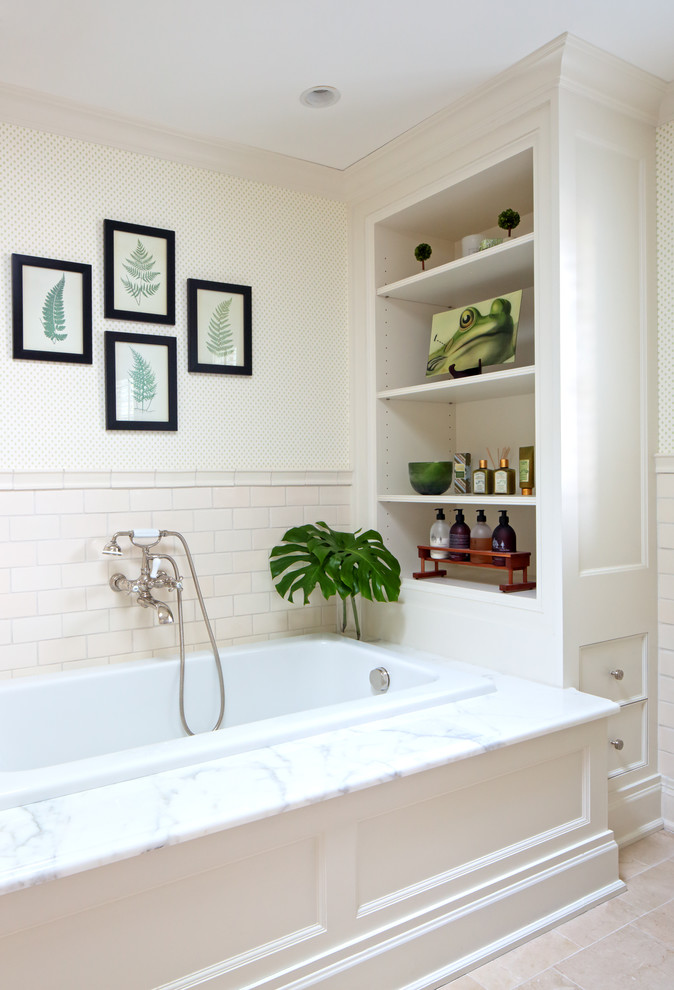 This is an example of a traditional bathroom in New York with a drop-in tub.