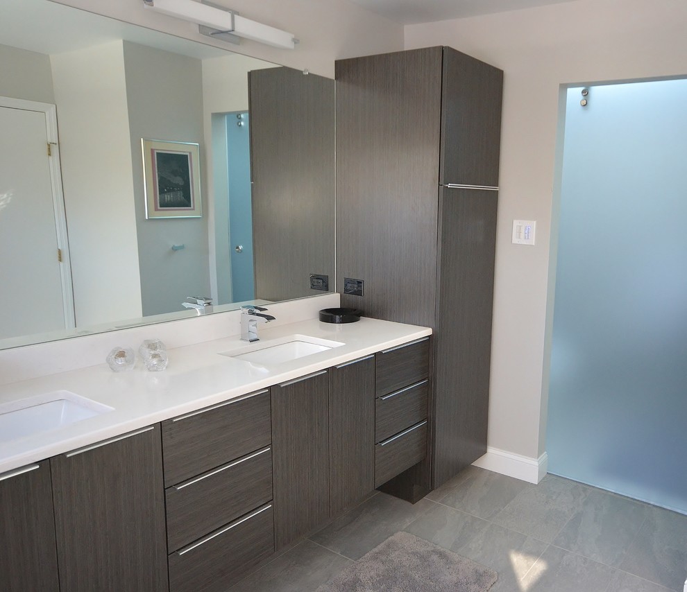 Inspiration for a large modern master bathroom in Philadelphia with flat-panel cabinets, dark wood cabinets, a japanese tub, a double shower, a one-piece toilet, gray tile, ceramic tile, beige walls, ceramic floors, an undermount sink, engineered quartz benchtops, beige floor and a sliding shower screen.