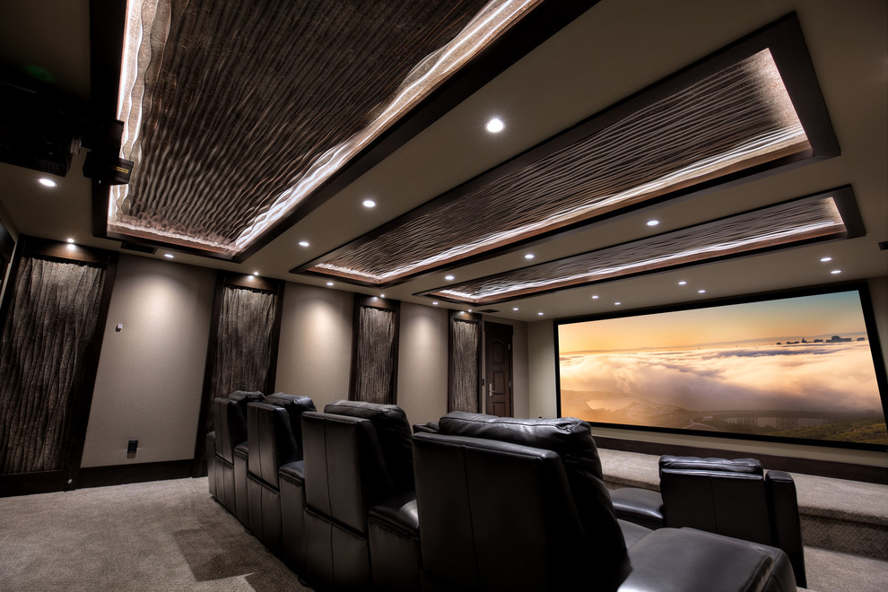Inspiration for a large transitional enclosed home theatre in Salt Lake City with beige walls, carpet and a projector screen.