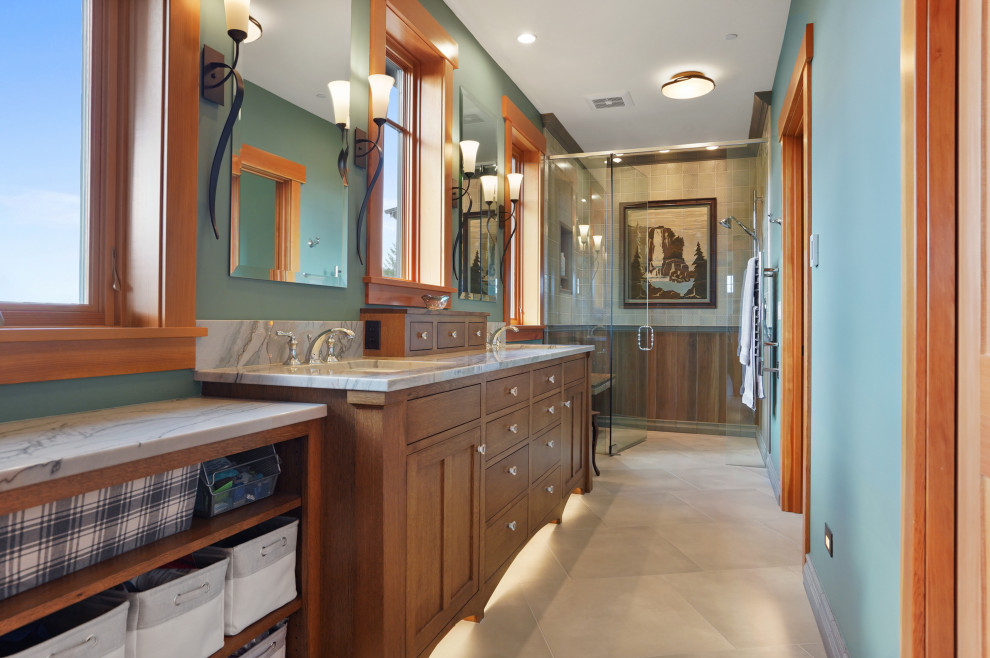 Design ideas for a large arts and crafts bathroom in Other with shaker cabinets, medium wood cabinets, a curbless shower, wood-look tile, green walls, porcelain floors, an undermount sink, granite benchtops, a shower curtain, grey benchtops, an enclosed toilet, a double vanity, a built-in vanity and decorative wall panelling.