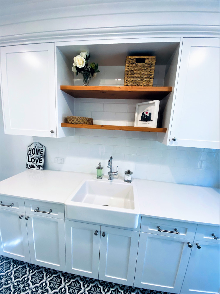 Beach style laundry room in Brisbane.