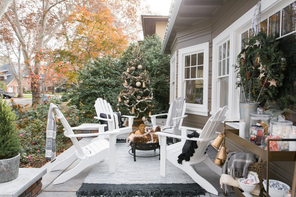 Inspiration for a transitional front yard verandah in Sacramento with concrete slab.
