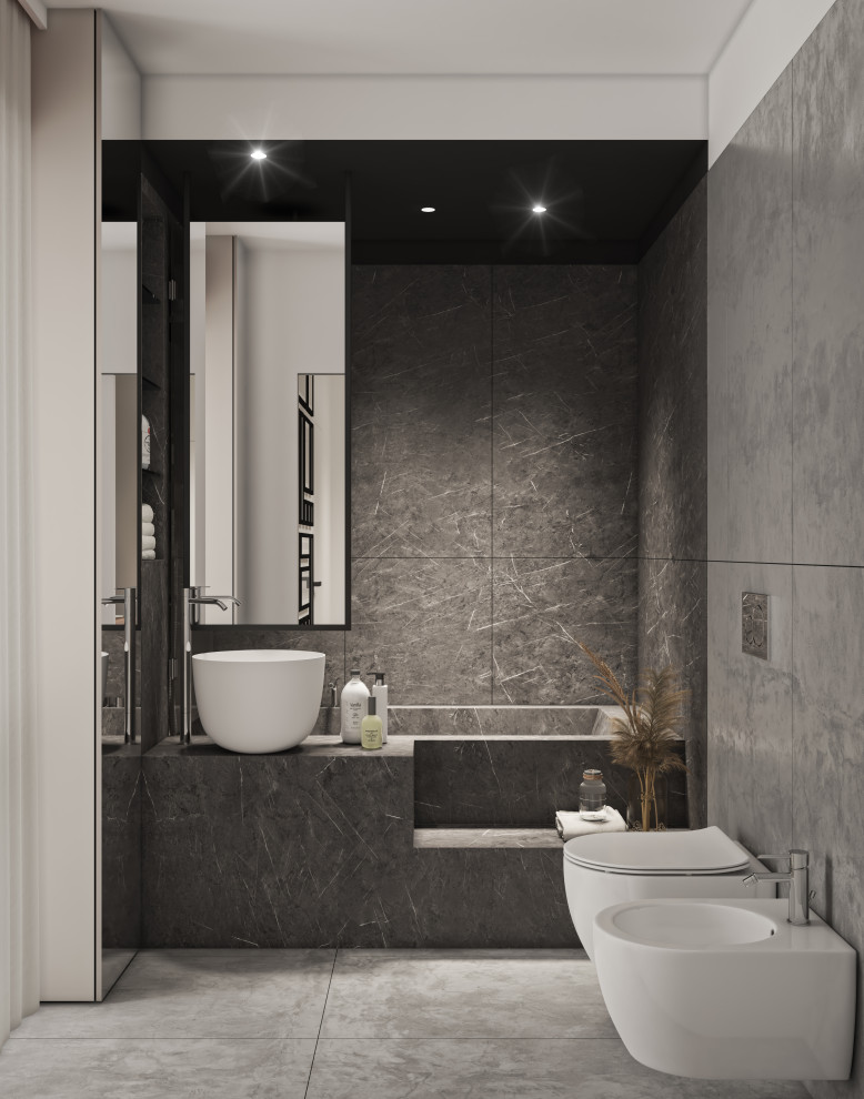 Идея дизайна: главная ванная комната среднего размера в современном стиле с стеклянными фасадами, белыми фасадами, ванной в нише, душем над ванной, раздельным унитазом, черной плиткой, керамогранитной плиткой, серыми стенами, полом из керамогранита, настольной раковиной, столешницей из плитки, серым полом, душем с распашными дверями, черной столешницей, тумбой под одну раковину и напольной тумбой