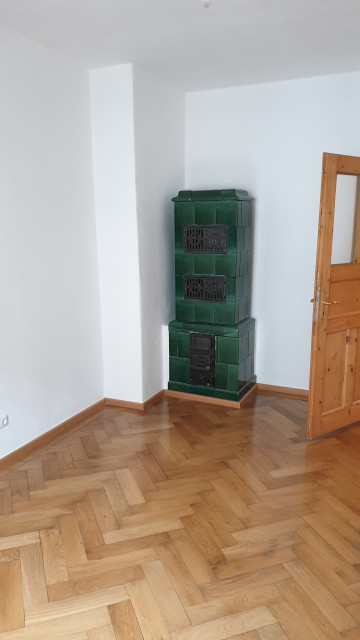 Kachelofen rustik-vardagsrum