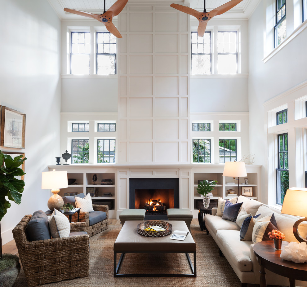 Photo of a transitional living room in San Francisco with white walls and a standard fireplace.