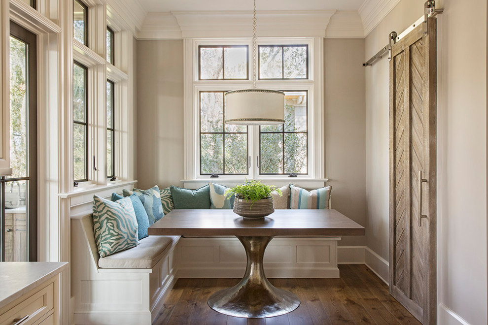Small beach style dining room in Charleston with grey walls, dark hardwood floors, no fireplace and brown floor.