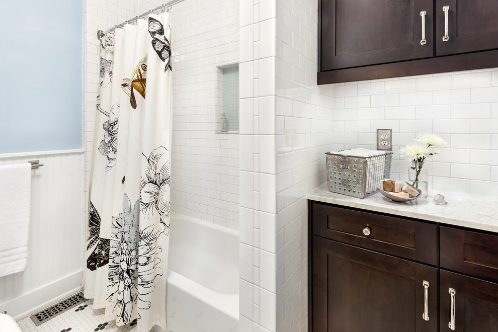 Design ideas for a mid-sized transitional bathroom in Other with dark wood cabinets, marble benchtops, an alcove tub, a shower/bathtub combo, yellow tile, subway tile, blue walls and ceramic floors.