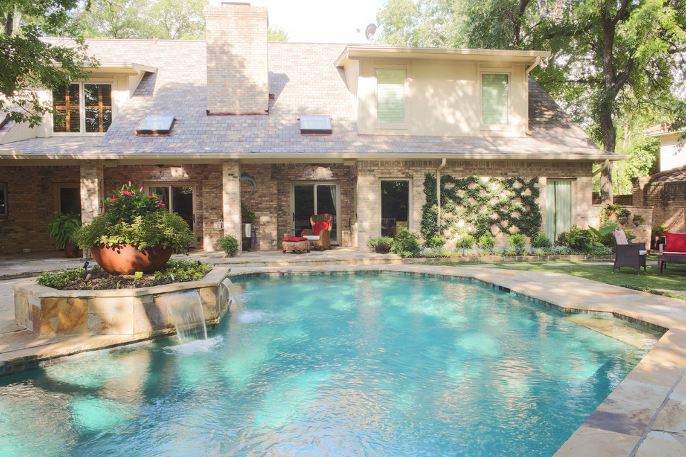 Inspiration for a large transitional backyard stone and custom-shaped water slide remodel