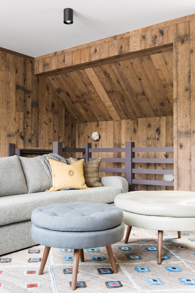 Sullivan's Island Remodel - Upstairs den featuring modern furniture and mushroom board walls and ceiling.
