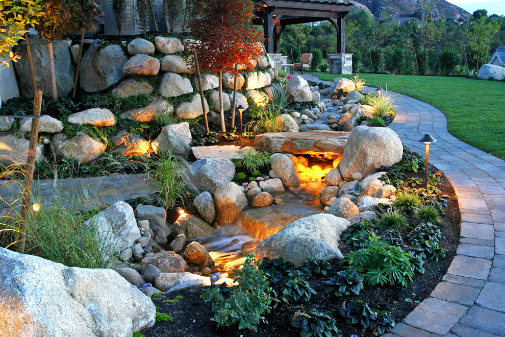 This is an example of a traditional garden in Salt Lake City with a water feature.