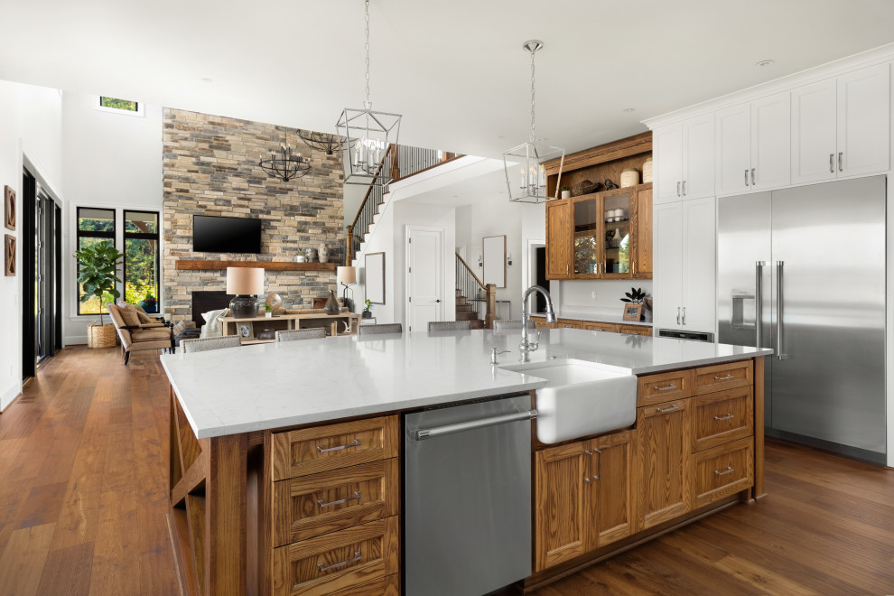 Inspiration for a large transitional kitchen in San Francisco with a single-bowl sink, light wood cabinets, marble benchtops, medium hardwood floors, with island and brown floor.
