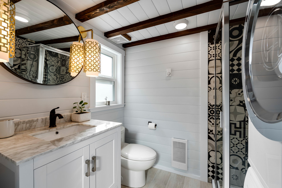 Example of a transitional home design design in Vancouver
