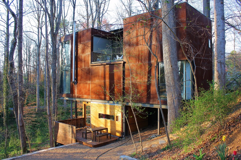This is an example of a modern exterior in Other with wood siding.
