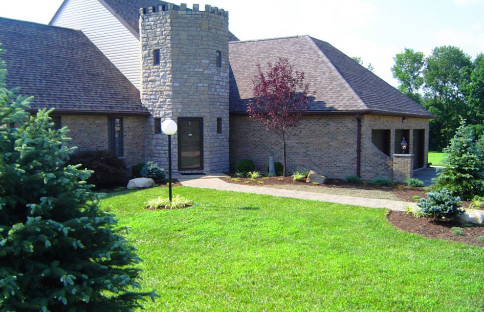Design ideas for a mid-sized transitional full sun front yard concrete paver landscaping in Cincinnati for spring.