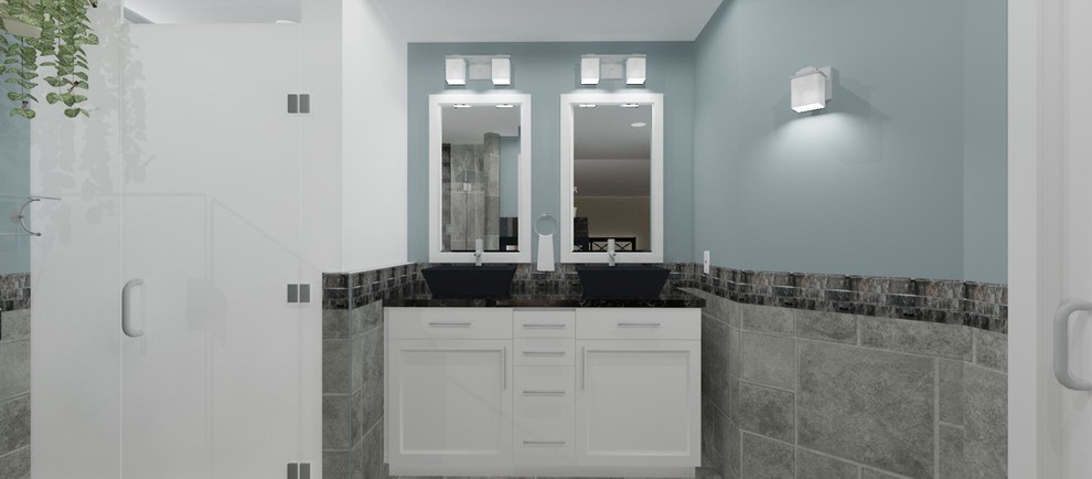 Example of a mid-sized transitional master multicolored tile and stone tile marble floor corner shower design in DC Metro with a vessel sink, shaker cabinets, white cabinets, granite countertops, a two-piece toilet and blue walls