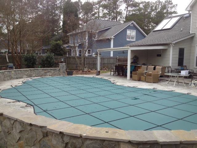 Pool - backyard stamped concrete and kidney-shaped pool idea
