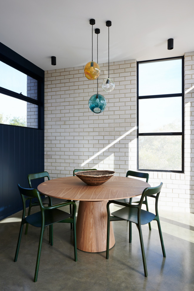 Inspiration for a large contemporary kitchen/dining combo in Adelaide with blue walls, concrete floors and grey floor.