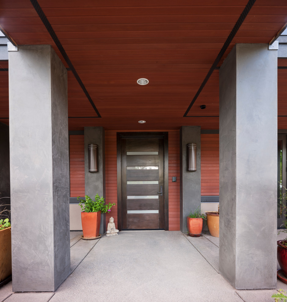 This is an example of a contemporary entryway in Seattle with red walls.