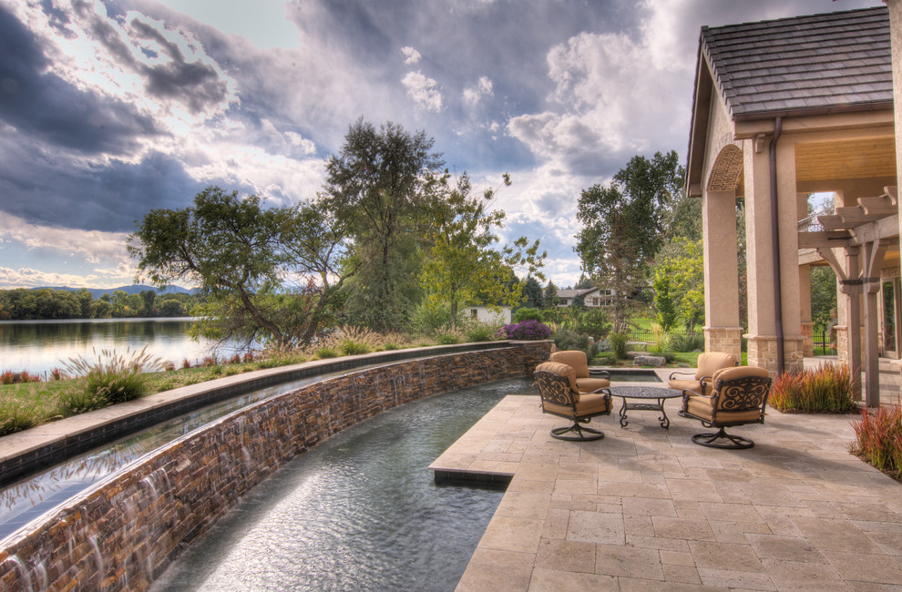 Mid-sized transitional backyard concrete paver and custom-shaped lap pool fountain photo