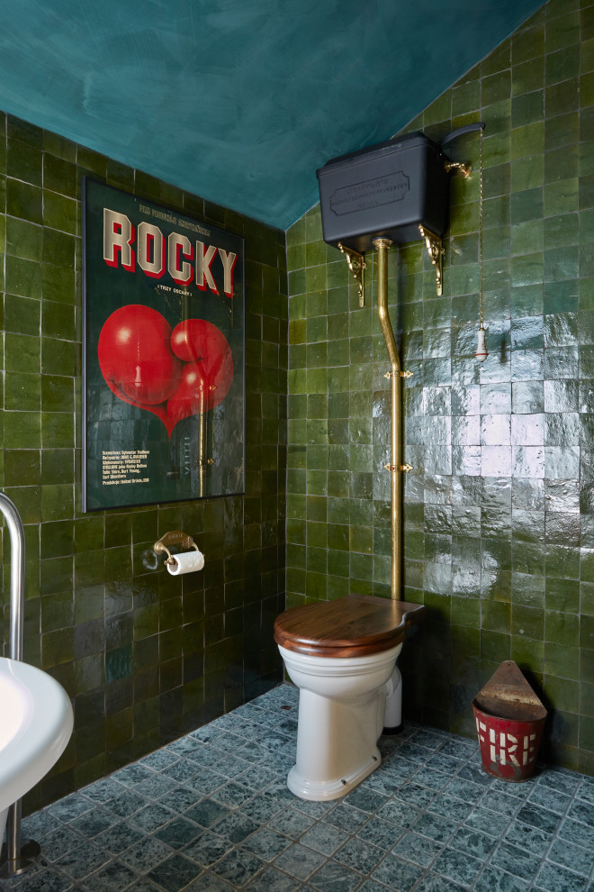 This is an example of a small eclectic bathroom in Sussex with a freestanding tub, an open shower, a two-piece toilet, green tile, ceramic tile, ceramic floors, marble benchtops, green floor, an open shower, multi-coloured benchtops, a niche, a single vanity and a freestanding vanity.