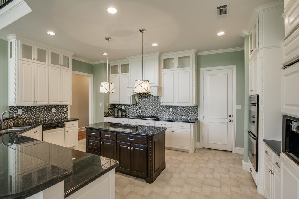Transitional ceramic tile open concept kitchen photo in Dallas with an undermount sink, glass-front cabinets, granite countertops, green backsplash, glass tile backsplash, stainless steel appliances and an island