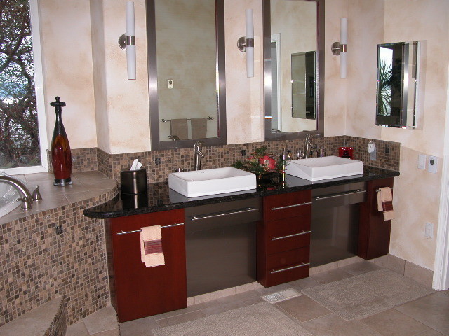 Bathroom - mid-sized transitional master brown tile and mosaic tile ceramic tile and gray floor bathroom idea with flat-panel cabinets, red cabinets, beige walls, a vessel sink and quartz countertops