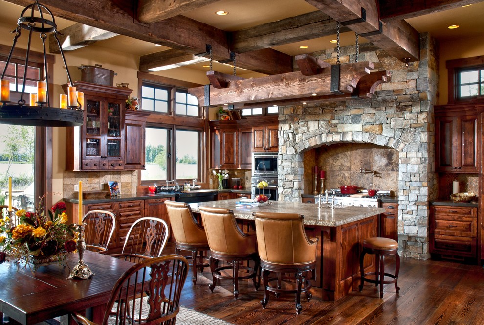 This is an example of a country kitchen/dining combo in Other with dark hardwood floors.