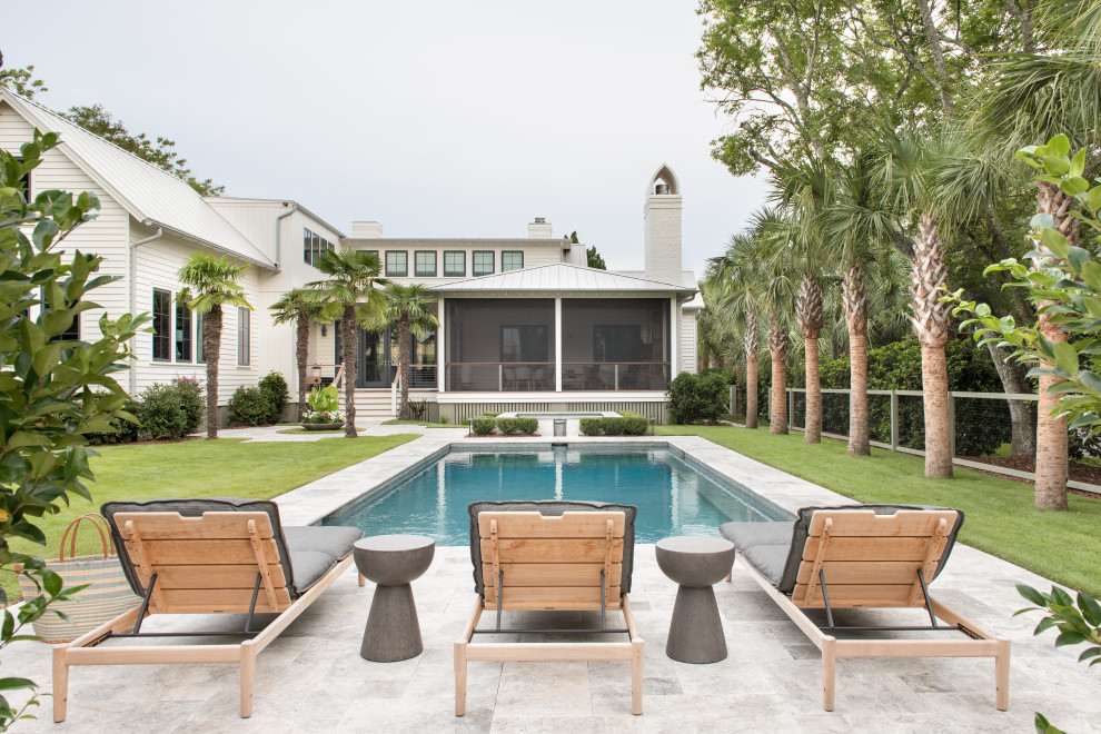 Beach style backyard rectangular pool in Charleston with a hot tub and natural stone pavers.