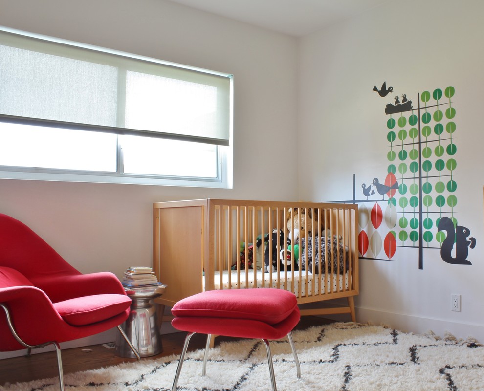 Inspiration for a mid-sized midcentury gender-neutral nursery in Los Angeles with white walls and light hardwood floors.