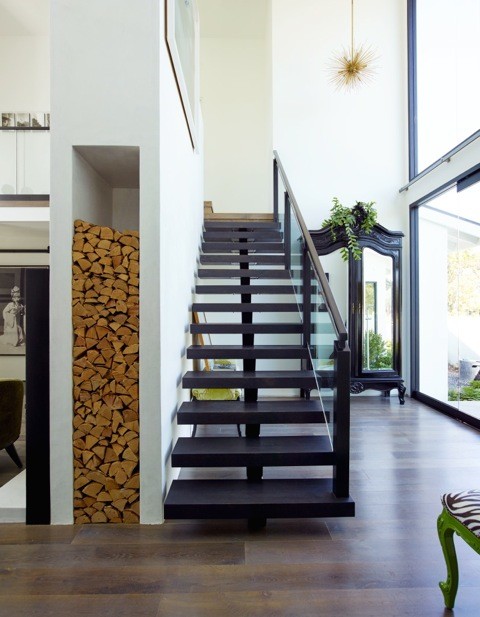 Mid-sized contemporary painted wood straight staircase in Orange County with open risers and wood railing.